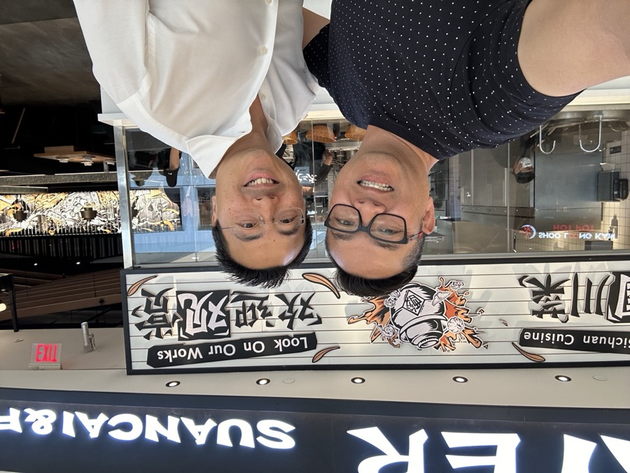 The founders outside a restaurant during a factory visit trip